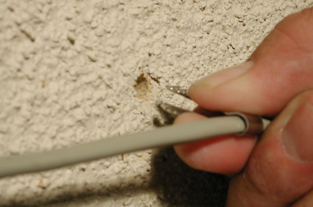How to fasten coaxial cable securely in stucco